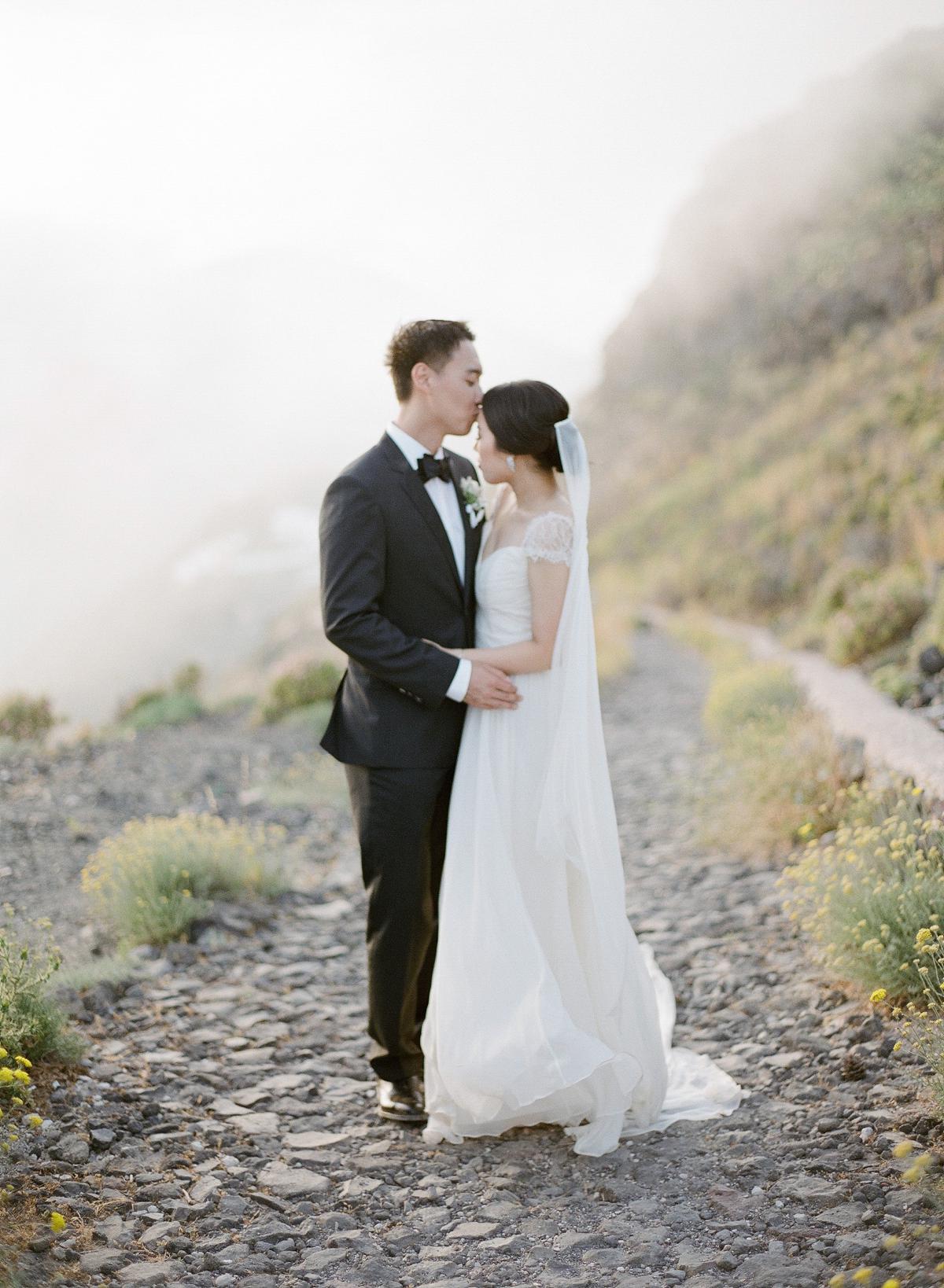 magical portrait of bride and groom in Santorini