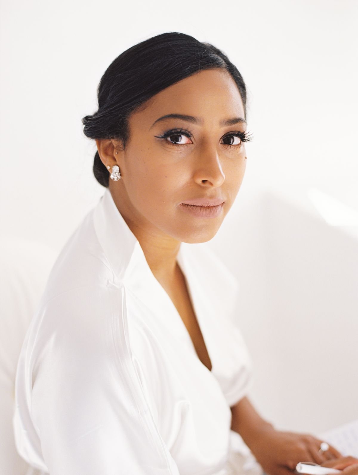 Portrait of bride before getting ready at Canaves Oia Santorini