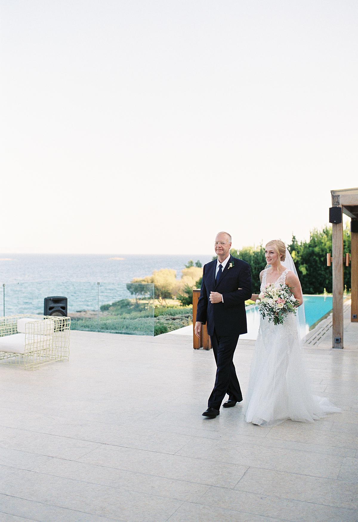 dad walking bride to the ceremony at athens private house 