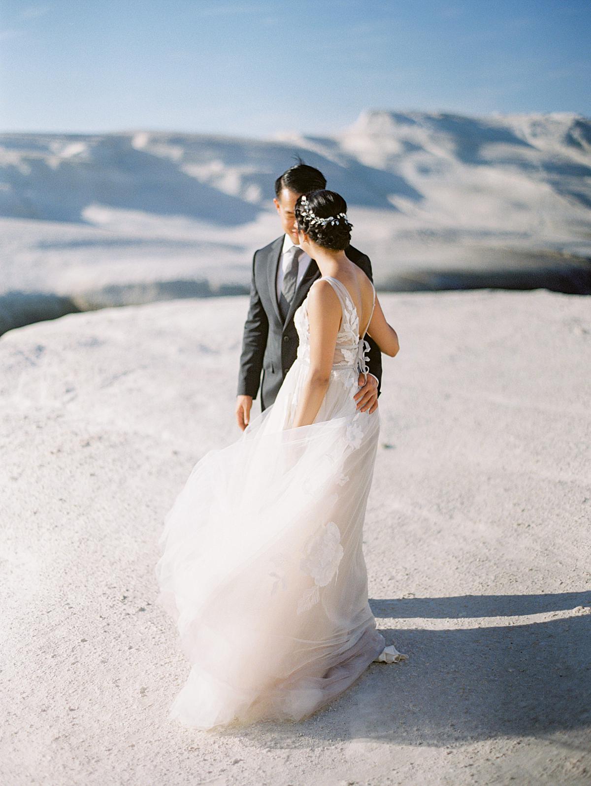 Bride and groom during their first look session in Milos island Greece