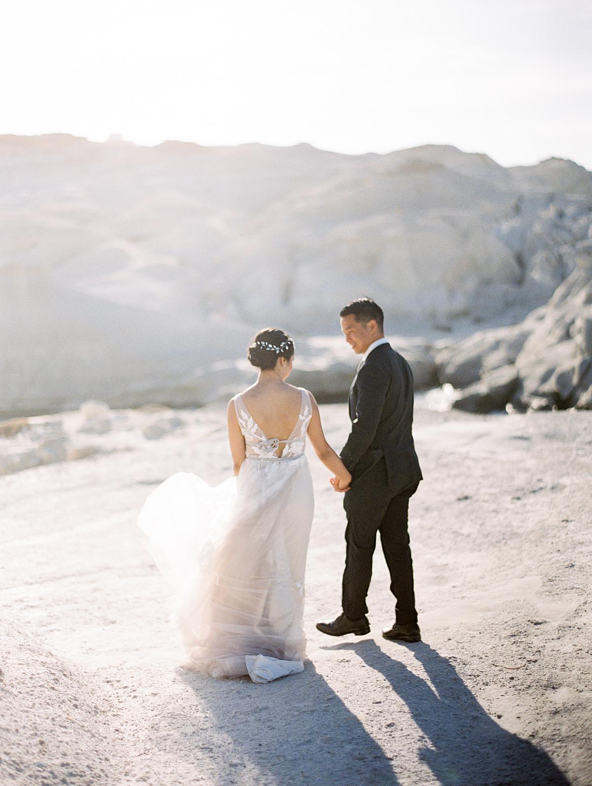 Bride and groom during their first look session in Milos island Greece