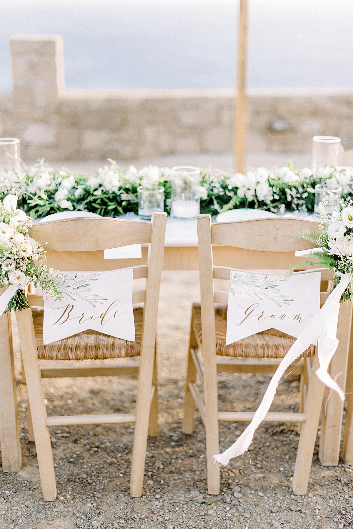 chairs at wedding table set up at milos wedding