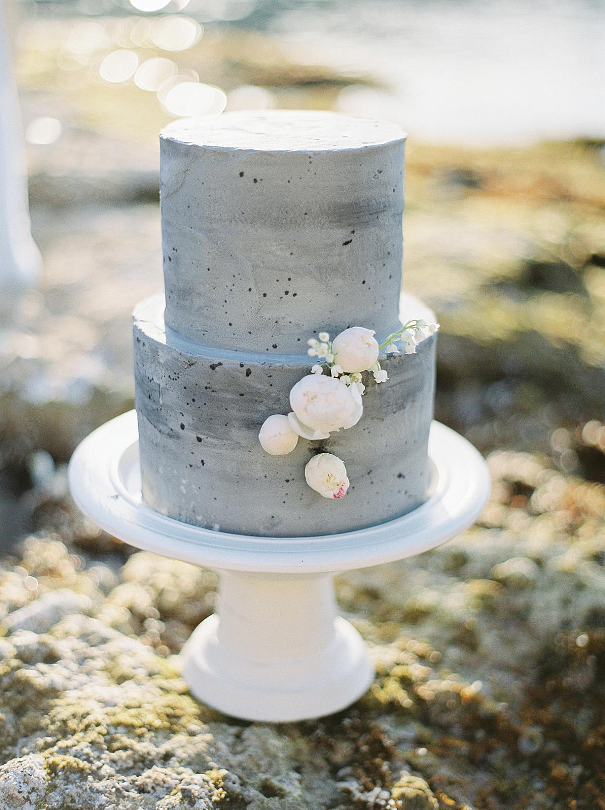 two tier destination wedding cake in nutral grey cement colors at a spetses wedding