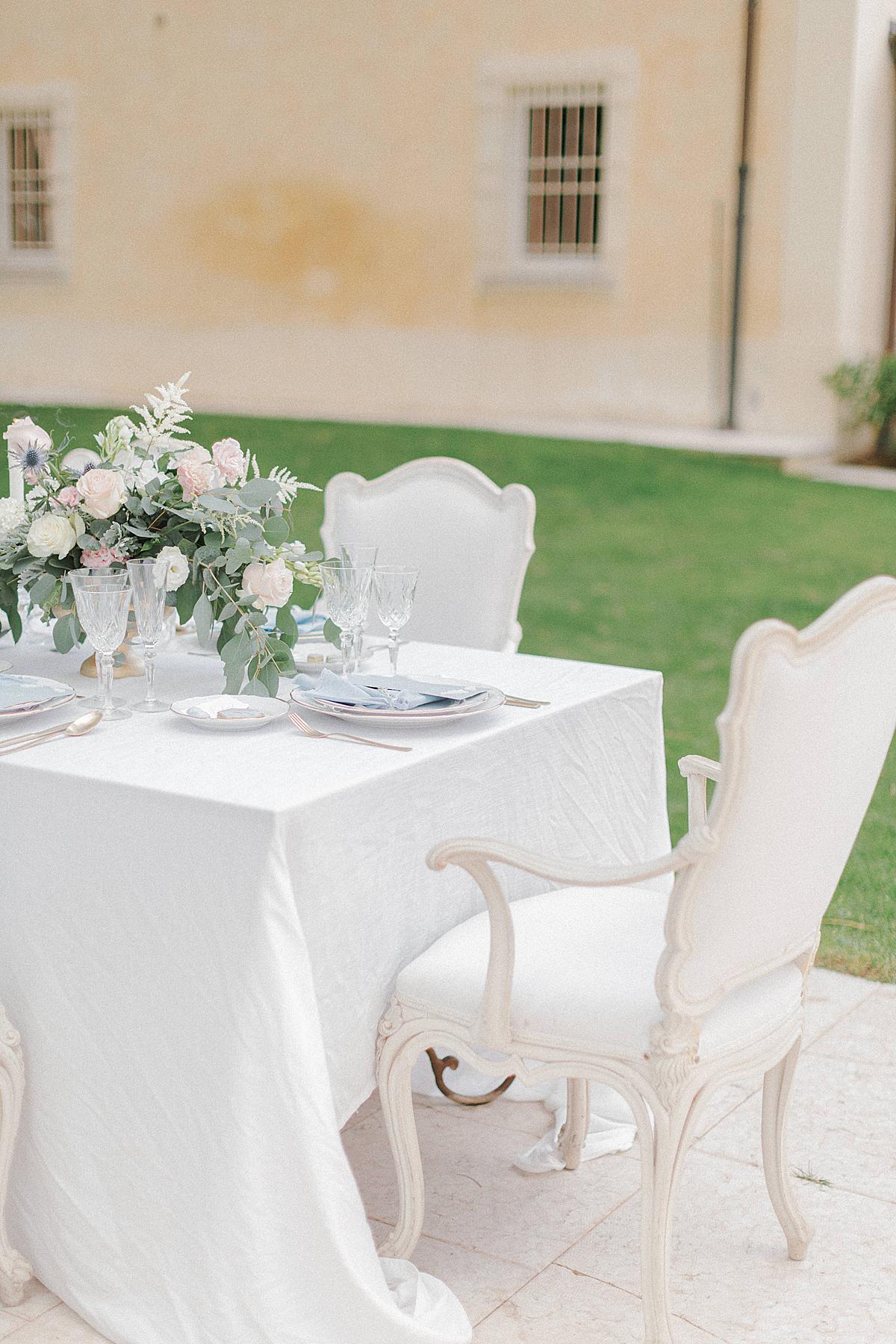 set up wedding table at L'Andana Resort in Tuscany