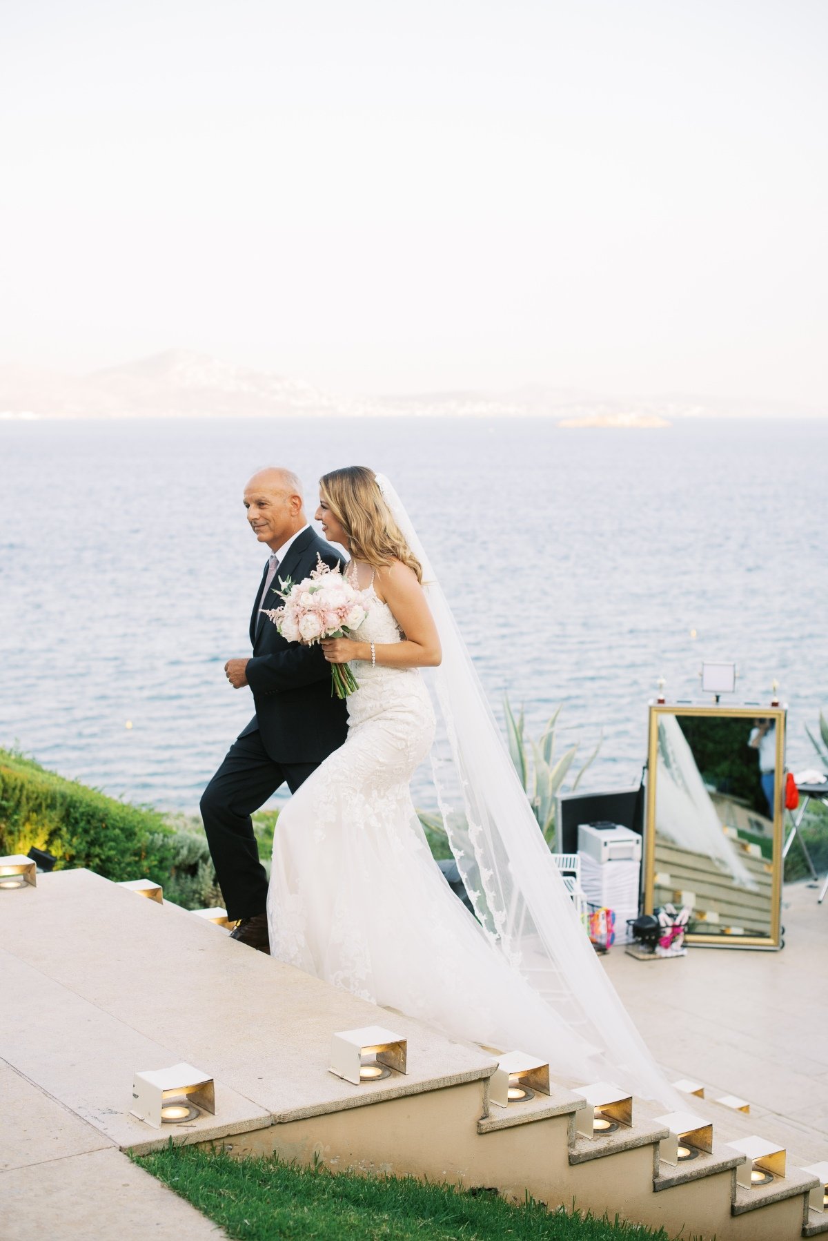 father-walking-blonde-bride-to-the-aisle-destination-wedding-in-athens