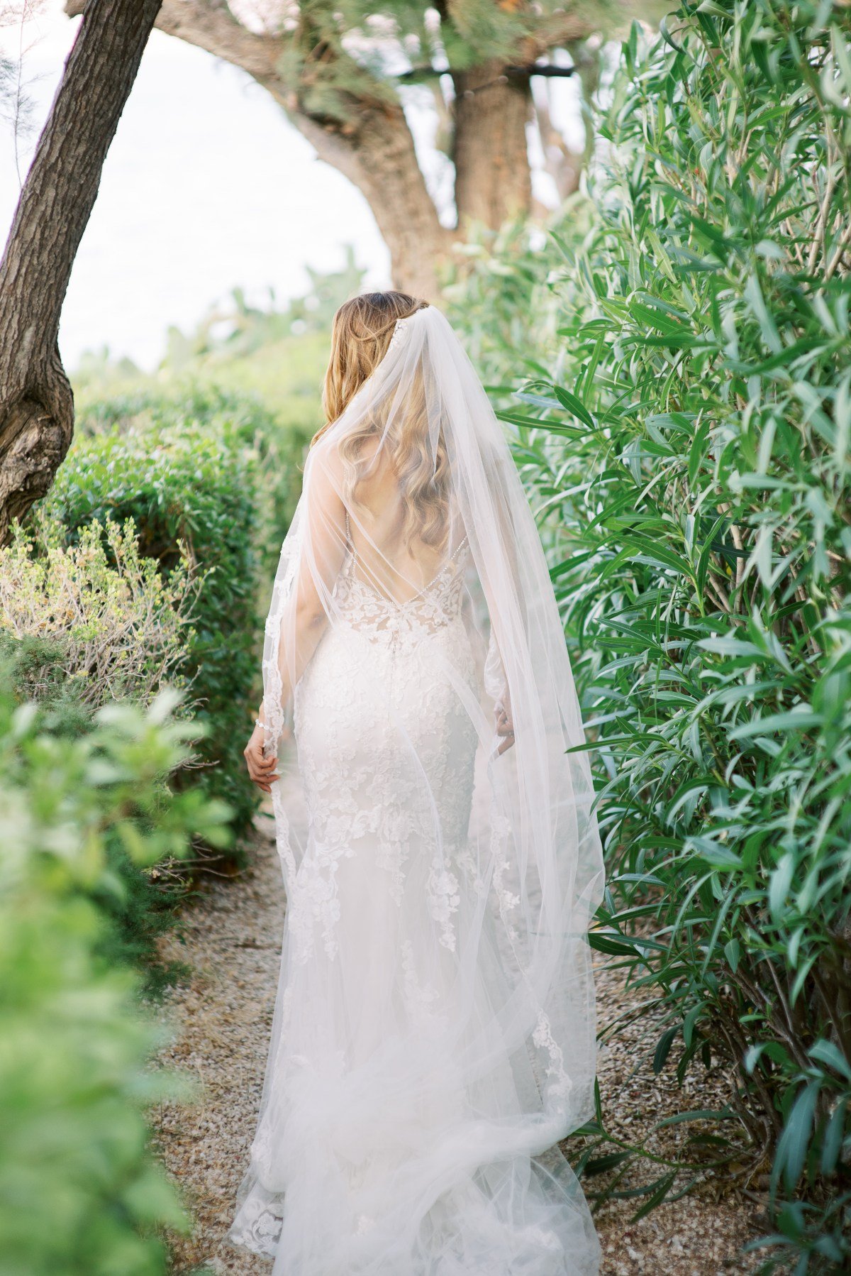 Bride walkin amongst the leaves - les anagnou editorial wedding photography